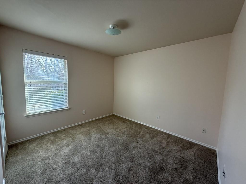 2224 Hummingbird Way Mesquite, TX 75181 - Photo 25 of 28 an empty room with a window
