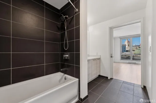 a bathroom with a bathtub and a shower