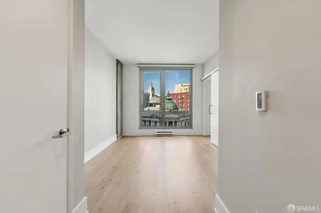 a view of a livingroom with wooden floor