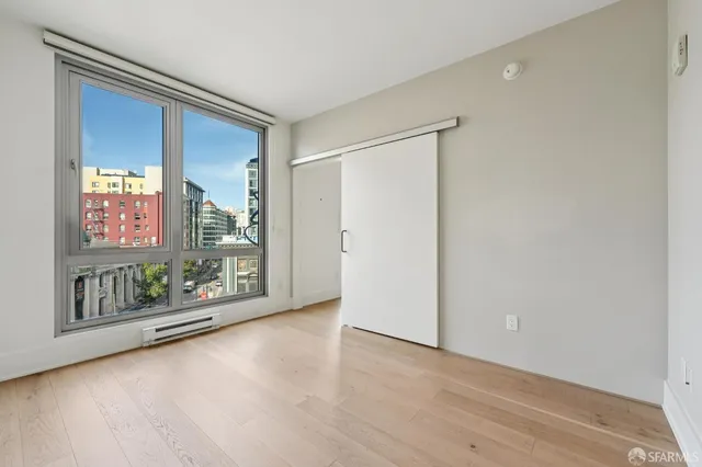 a view of livingroom with furniture wooden floor and window