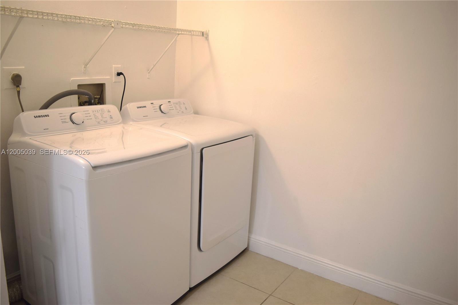 5628 Rock Island Road, Unit 185 Tamarac, FL 33319 - Photo 7 of 29 a utility room with dryer and washer