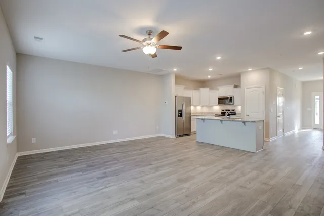 a view of kitchen with wooden floor and window