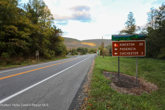 a view of a street with a park