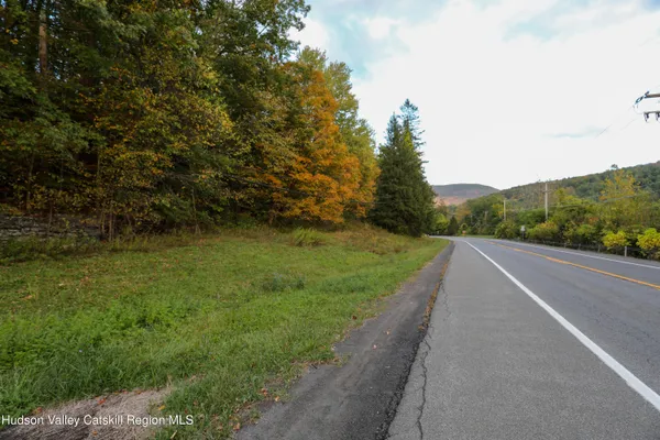 a view of a road with a yard