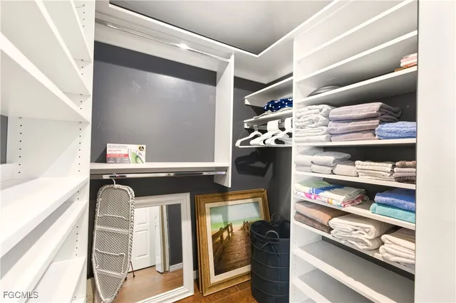 a kitchen with a refrigerator and cabinets