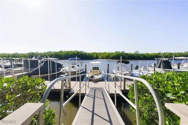 a view of a chairs and table on the balcony