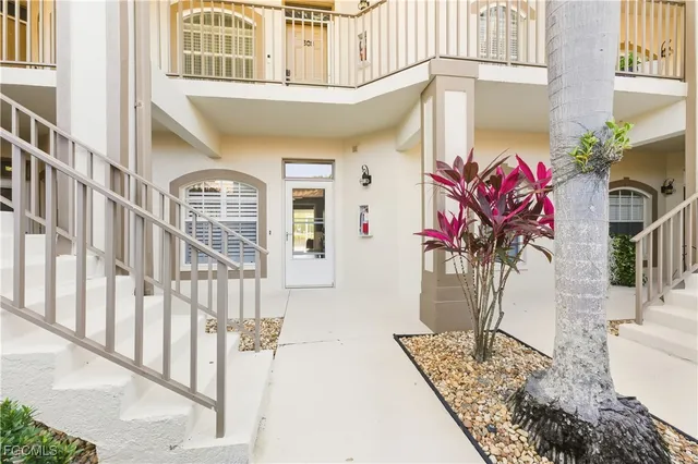 a view of a house with a potted plant