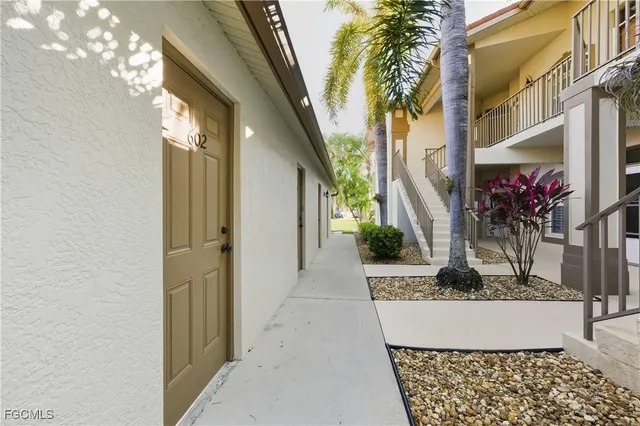 a view of a house with a fountain in a corridor