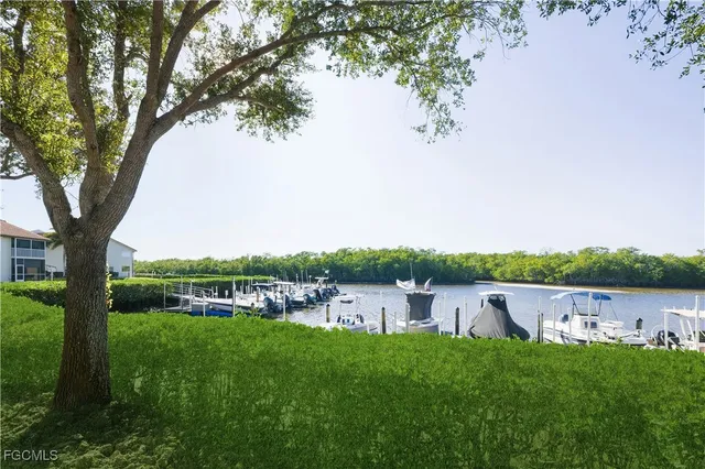a view of a lake with a house in the background