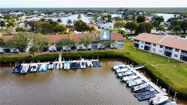 an aerial view of a house with a ocean view