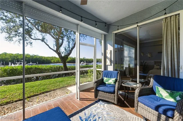 a view of a couches in patio with a yard