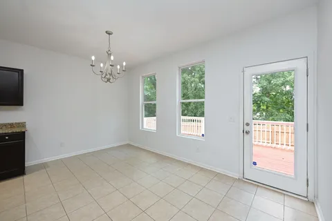 a view of a livingroom with an empty space and a fireplace