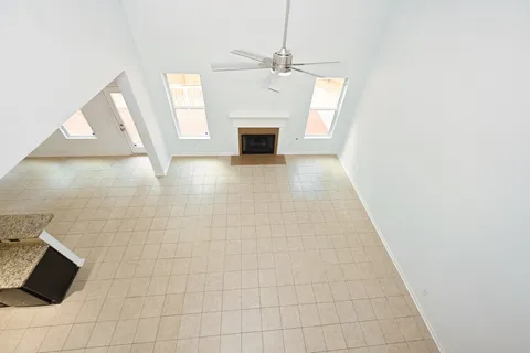 a view of a kitchen with furniture and an empty room