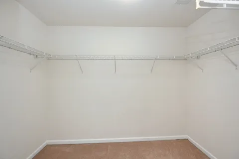 a view of balcony with wooden floor and fence