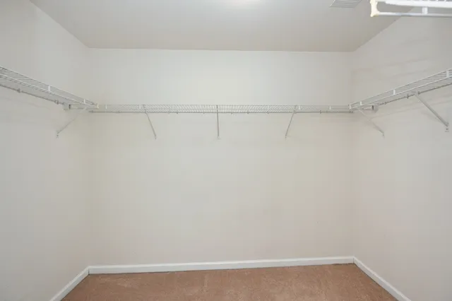 a view of balcony with wooden floor and fence