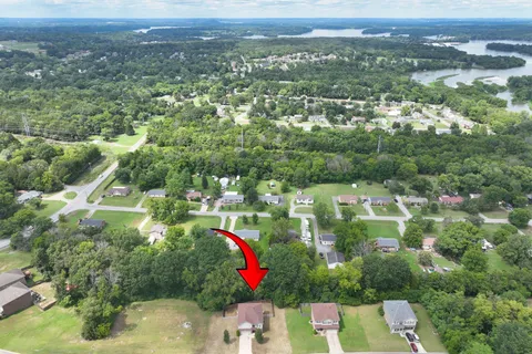 an aerial view of house with yard