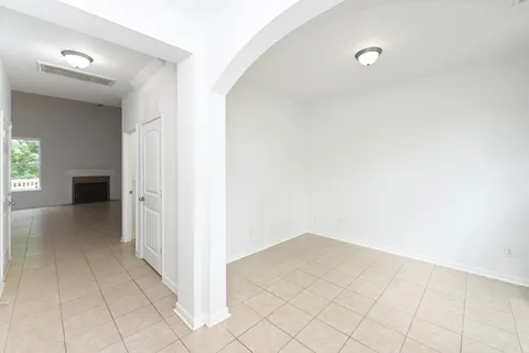 a view of a room with a hallway