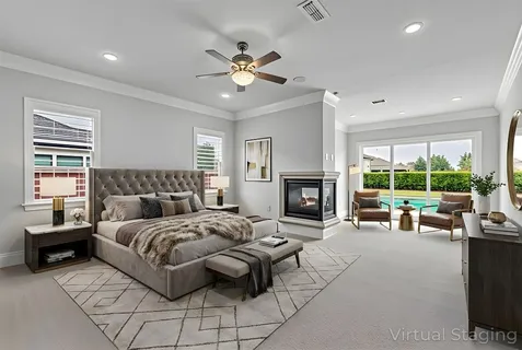 a spacious bedroom with a large bed and a fireplace