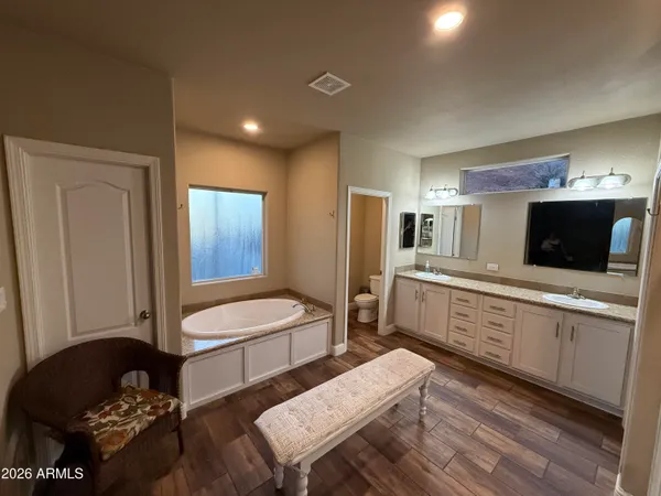 a large kitchen with a table and chairs