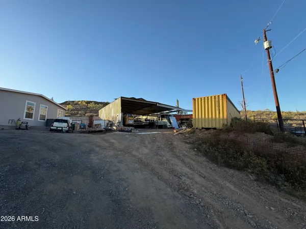 a view of a car parked in back of a house