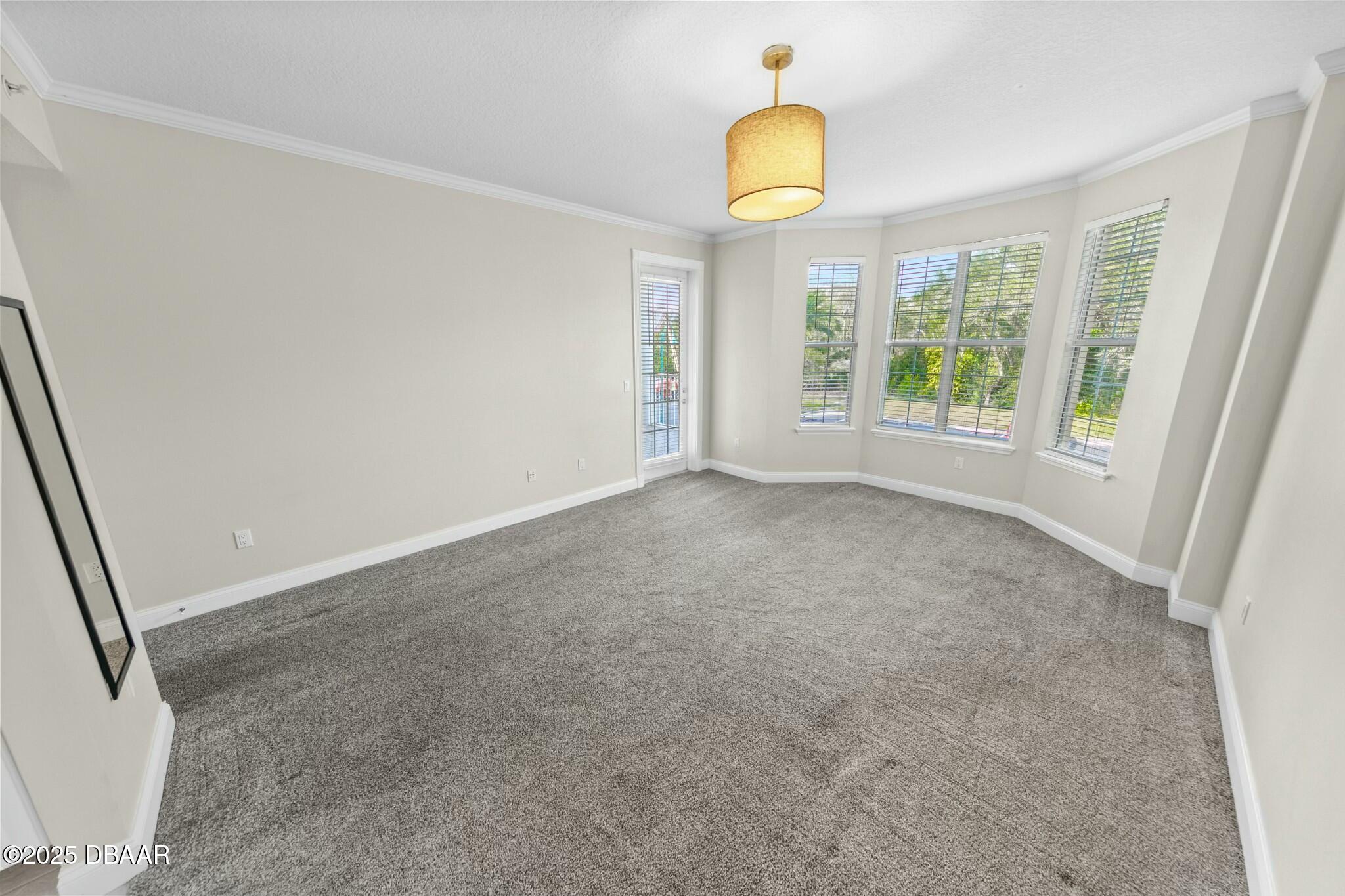 4623 Rivers Edge Village Lane, Unit 6204 Ponce Inlet, FL 32127 - Photo 12 of 51 an empty room with windows