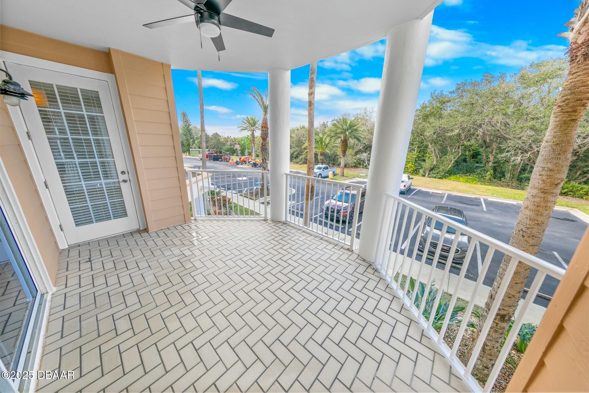 4623 Rivers Edge Village Lane, Unit 6204 Ponce Inlet, FL 32127 - Photo 20 of 51 a bedroom with furniture and large window