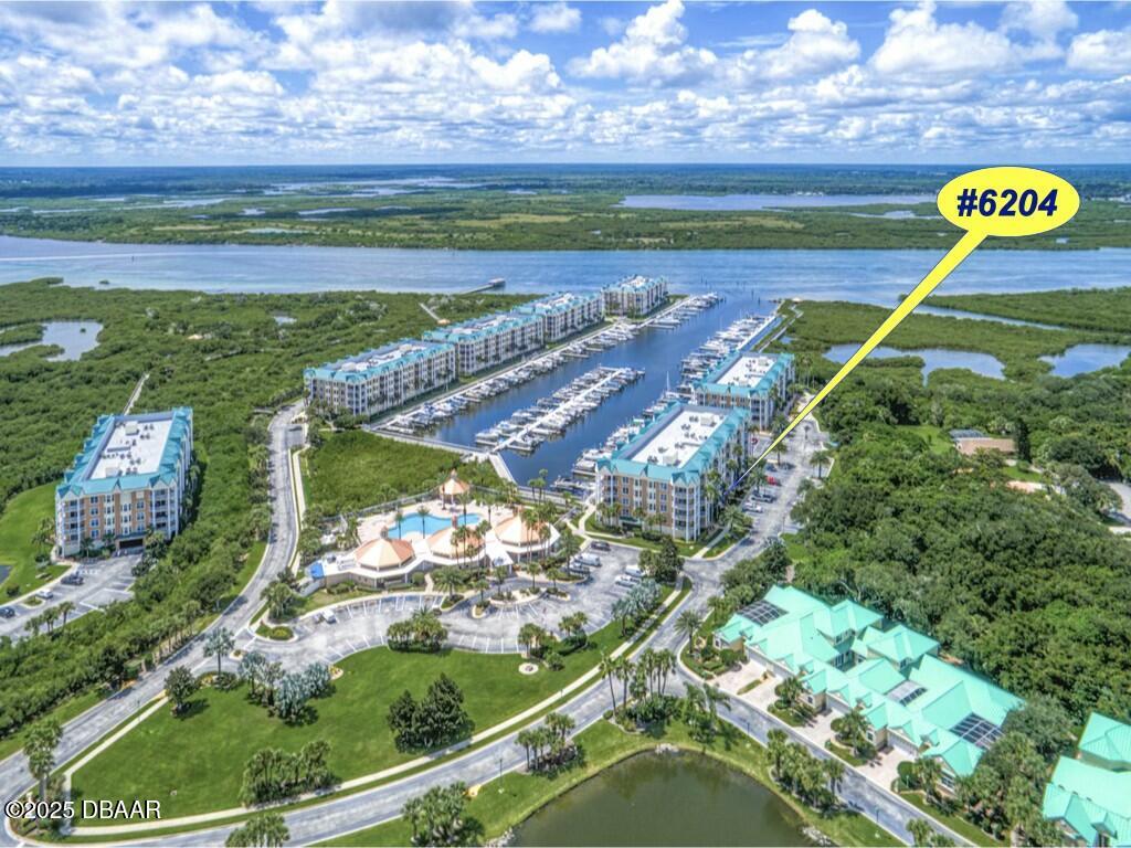 4623 Rivers Edge Village Lane, Unit 6204 Ponce Inlet, FL 32127 - Photo 2 of 51 a view of a tennis court