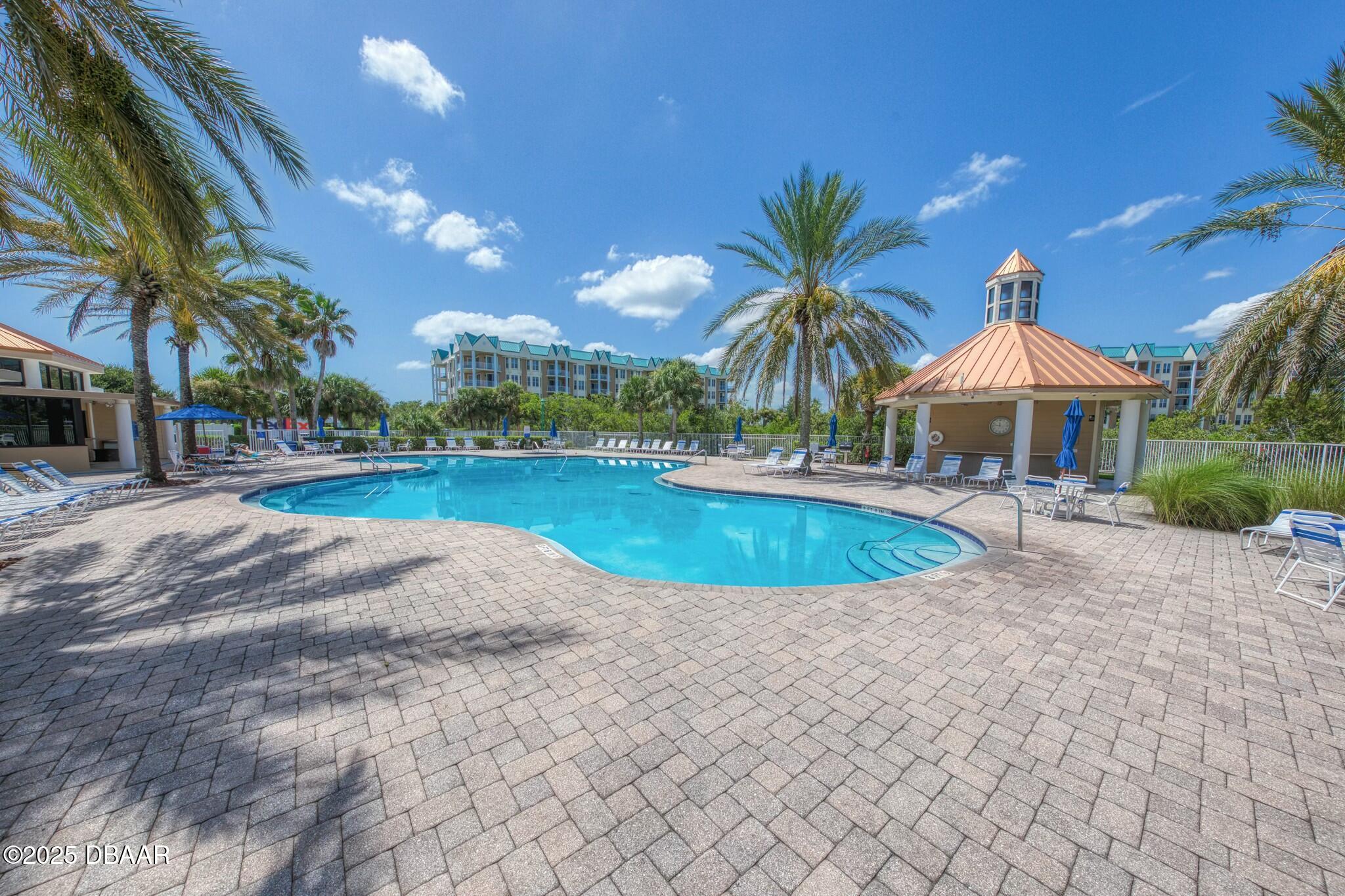 4623 Rivers Edge Village Lane, Unit 6204 Ponce Inlet, FL 32127 - Photo 27 of 51 a view of outdoor space yard and swimming pool