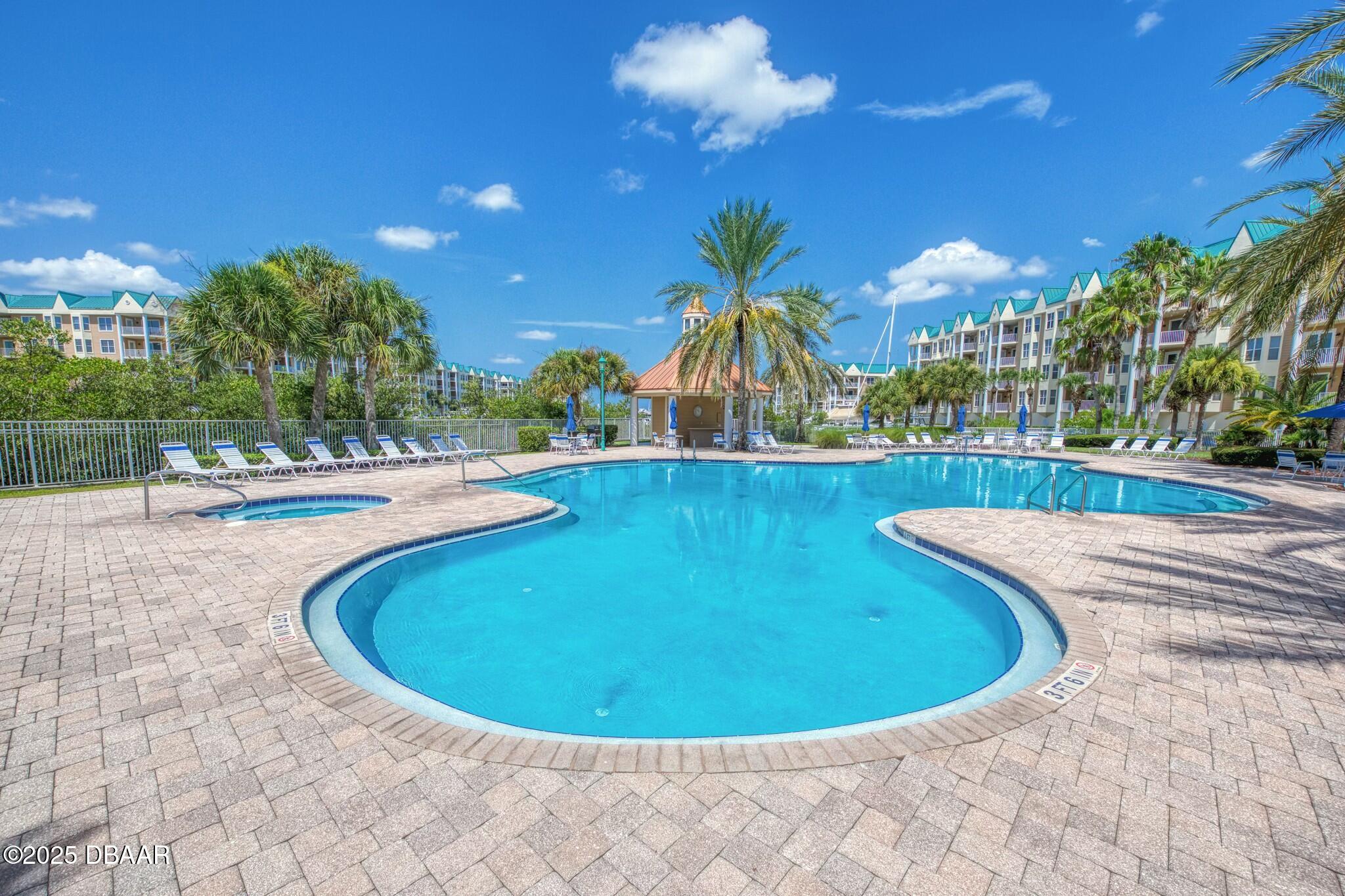 4623 Rivers Edge Village Lane, Unit 6204 Ponce Inlet, FL 32127 - Photo 28 of 51 a view of a swimming pool with a patio