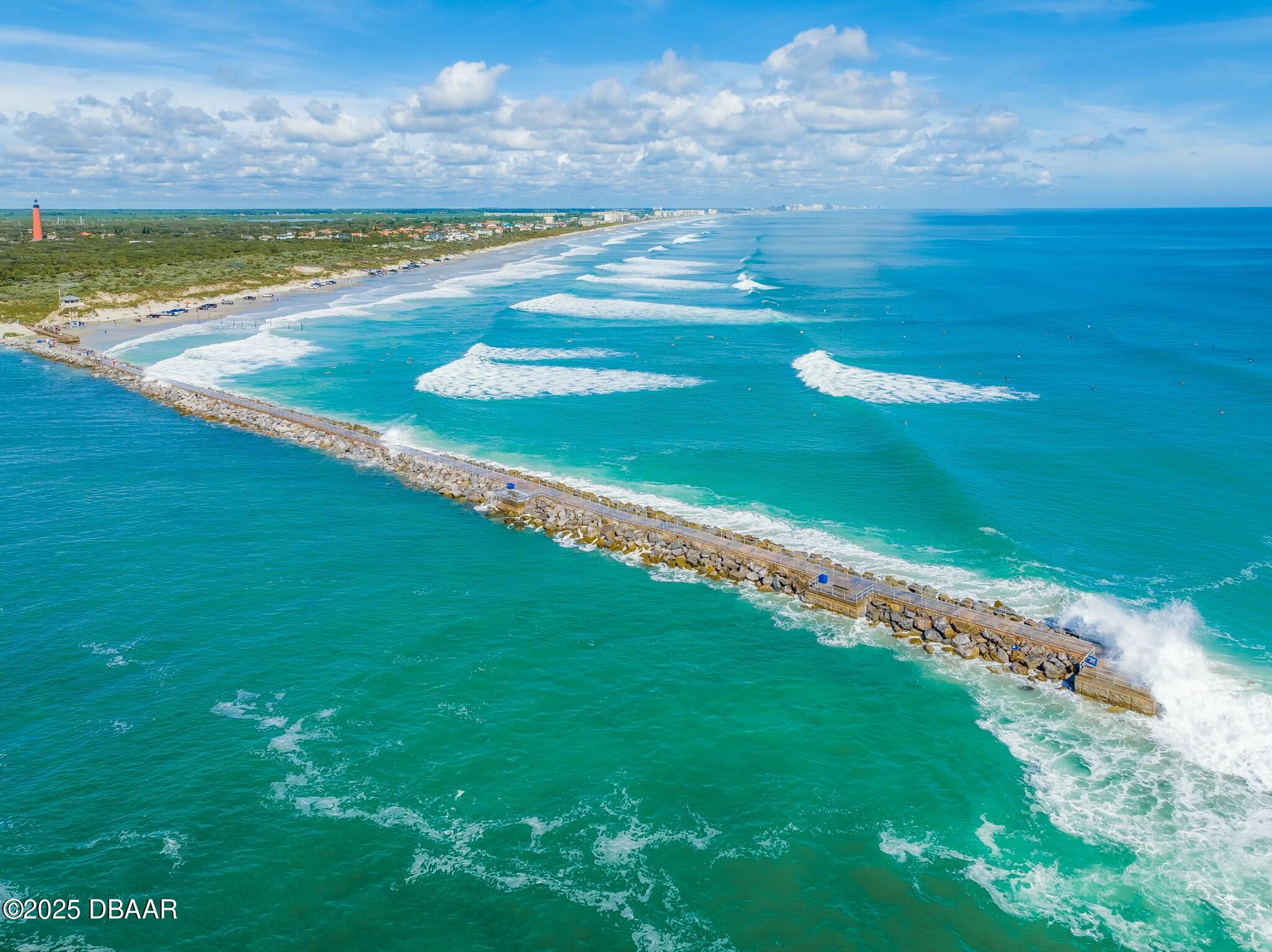 4623 Rivers Edge Village Lane, Unit 6204 Ponce Inlet, FL 32127 - Photo 37 of 51 a view of an ocean and beach
