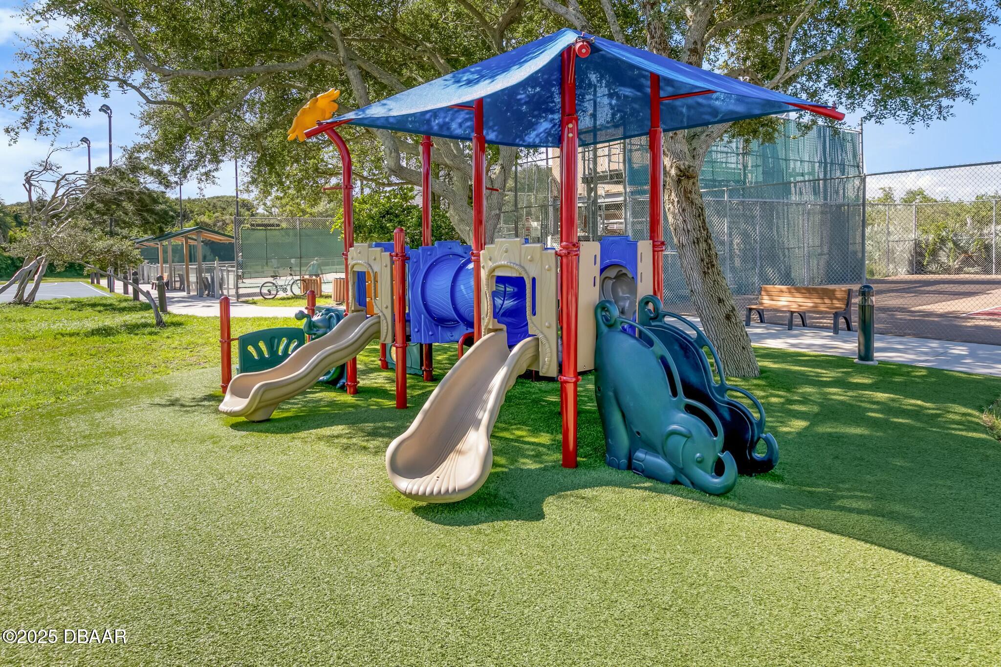 4623 Rivers Edge Village Lane, Unit 6204 Ponce Inlet, FL 32127 - Photo 49 of 51 a view of a park with a slide