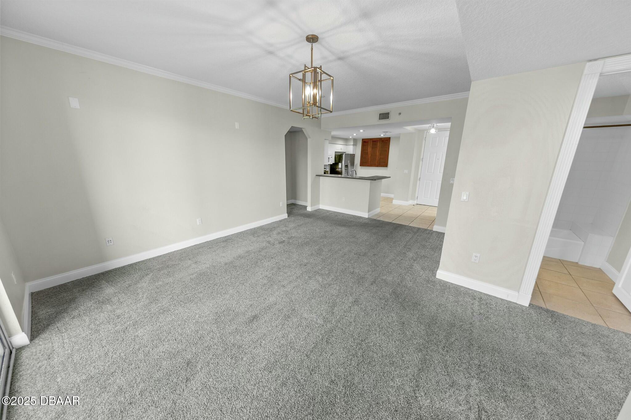 4623 Rivers Edge Village Lane, Unit 6204 Ponce Inlet, FL 32127 - Photo 6 of 51 a view of an empty room and window