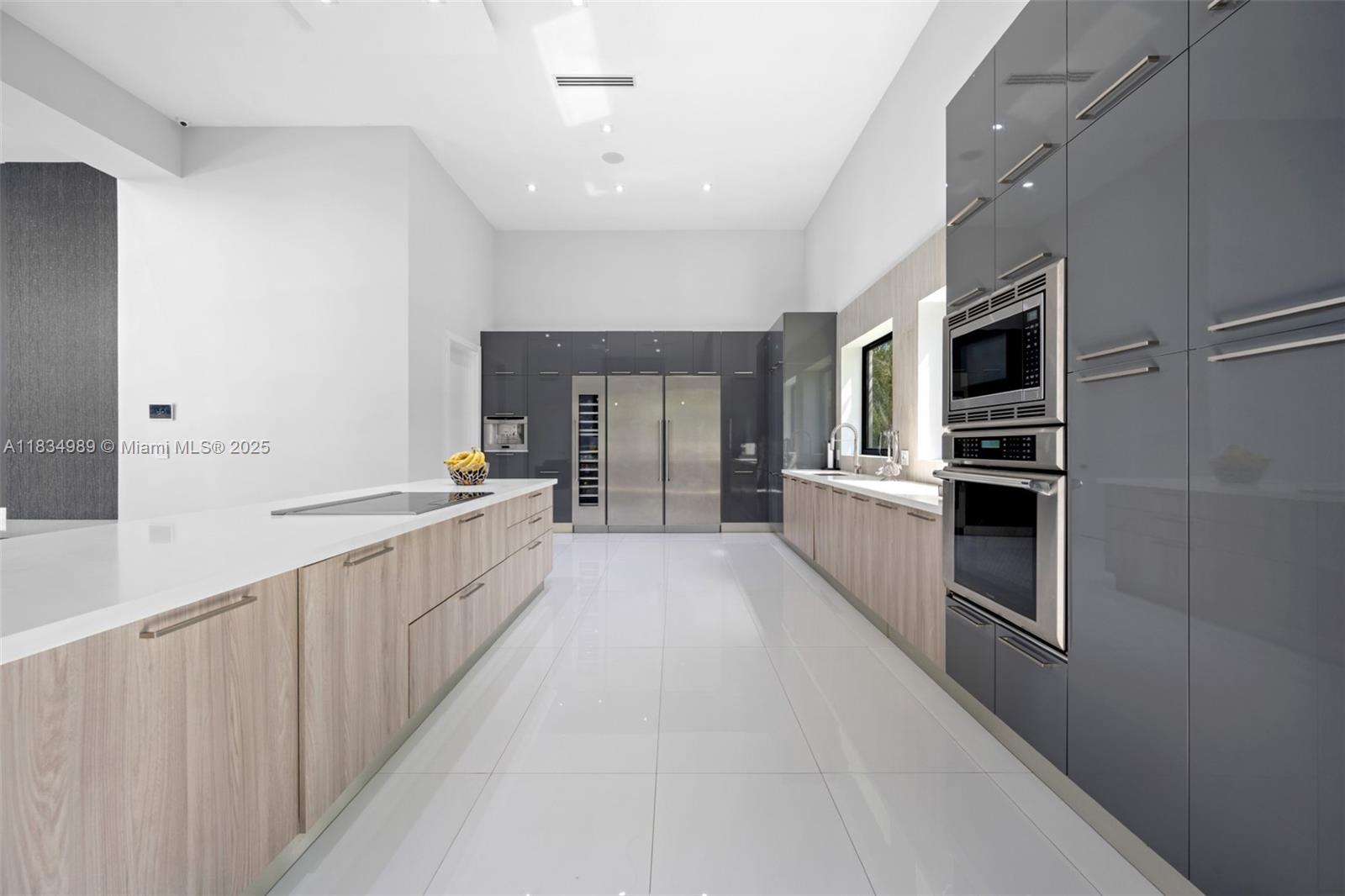 11350 Northwest 8th Street Plantation, FL 33325 - Photo 15 of 68 a kitchen with stainless steel appliances a refrigerator and a stove top oven