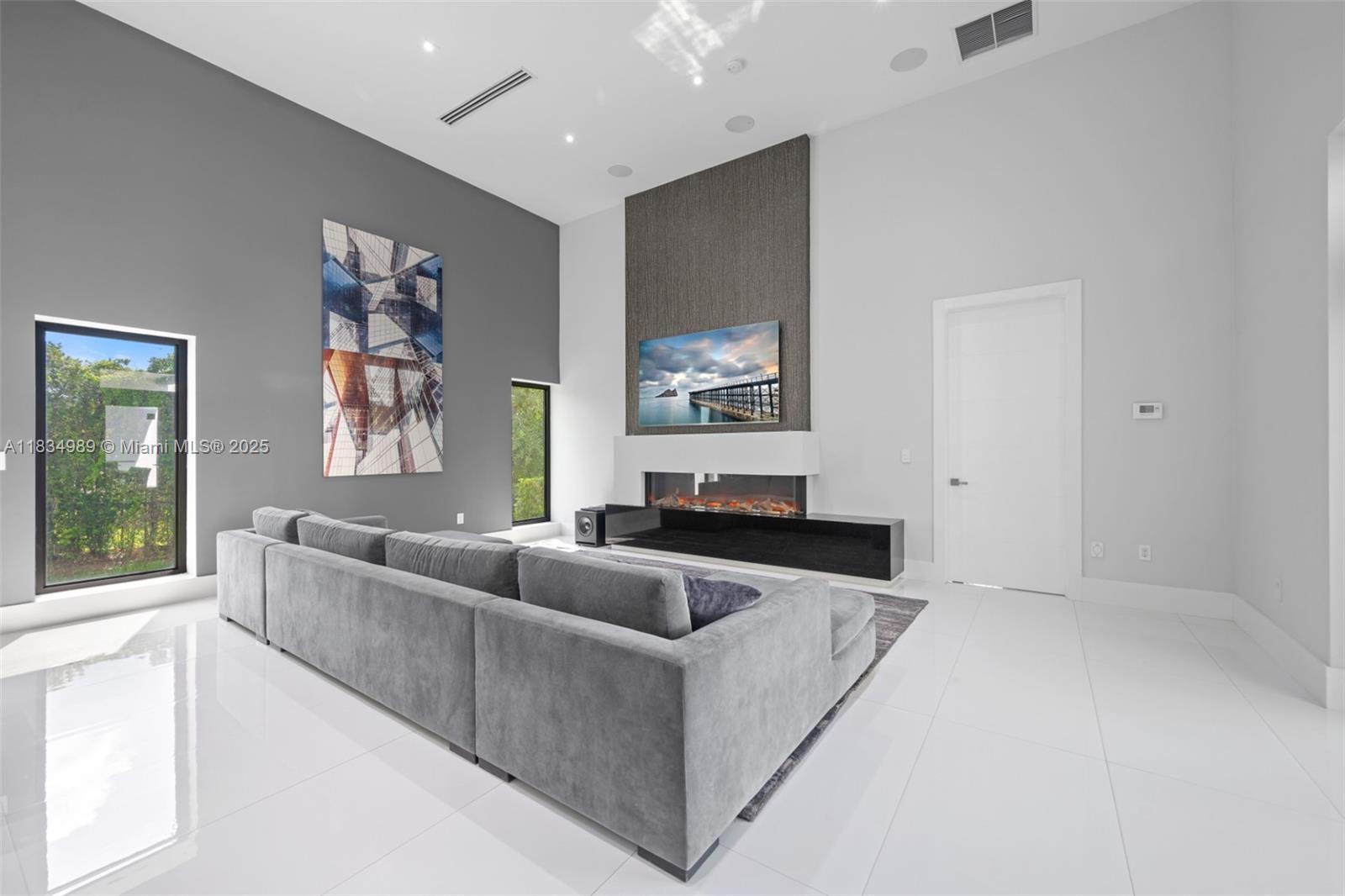 11350 Northwest 8th Street Plantation, FL 33325 - Photo 16 of 68 a living room with furniture and a flat screen tv