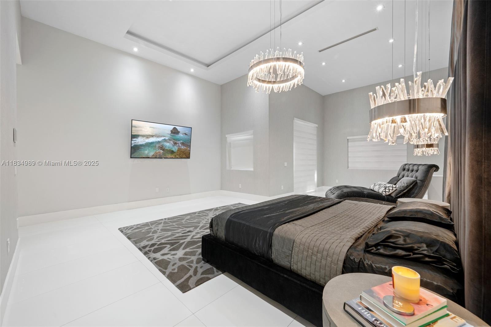 11350 Northwest 8th Street Plantation, FL 33325 - Photo 19 of 68 a bedroom with a bed and a chandelier