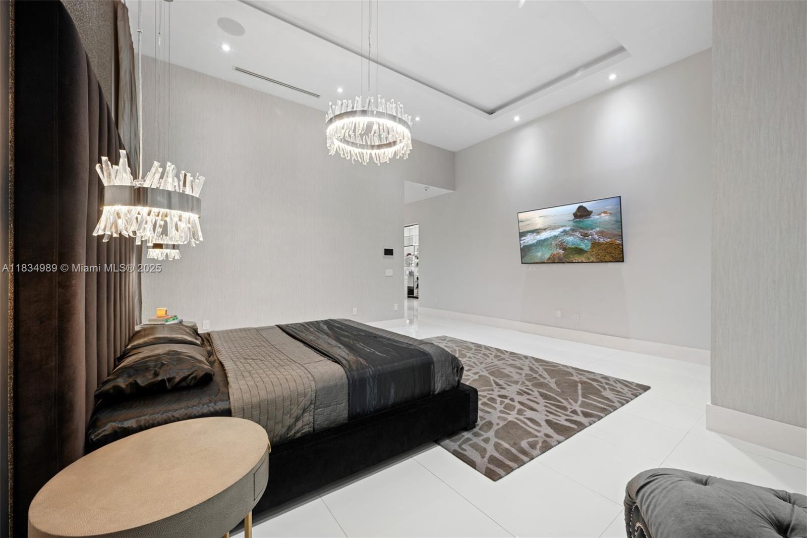 11350 Northwest 8th Street Plantation, FL 33325 - Photo 20 of 68 a bedroom with bed and a chandelier