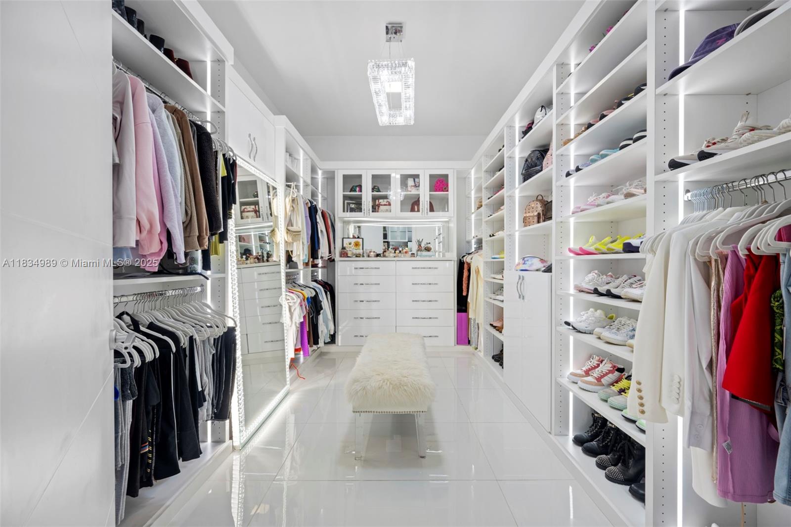 11350 Northwest 8th Street Plantation, FL 33325 - Photo 22 of 68 a view of walk in closet with clothes and shoes