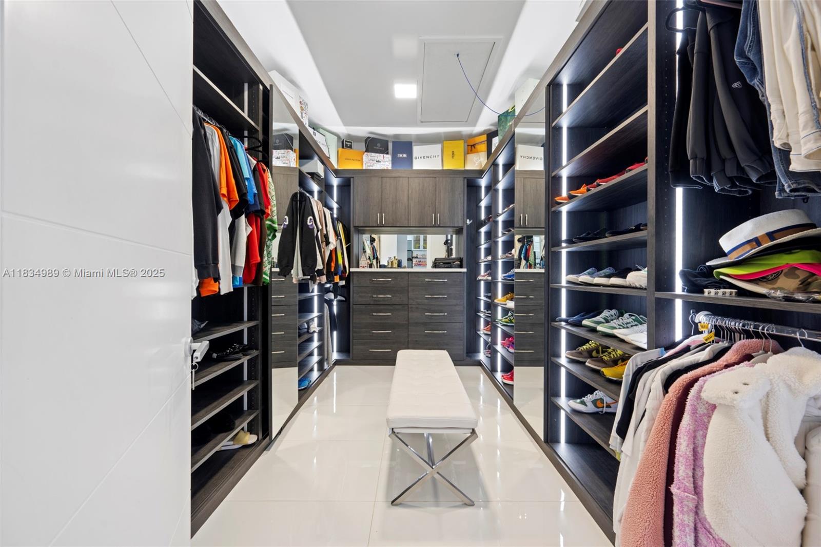 11350 Northwest 8th Street Plantation, FL 33325 - Photo 23 of 68 a view of walk in closet with clothes and shoes