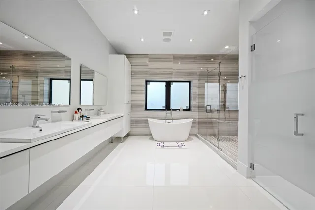 a bed room with furniture and a flat screen tv