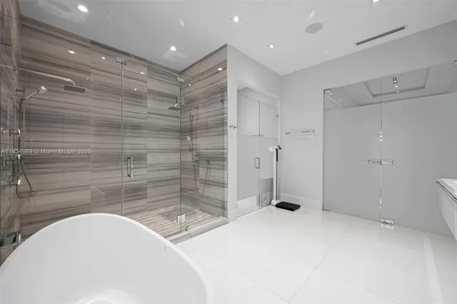 a bathroom with a toilet sink shower and bathtub