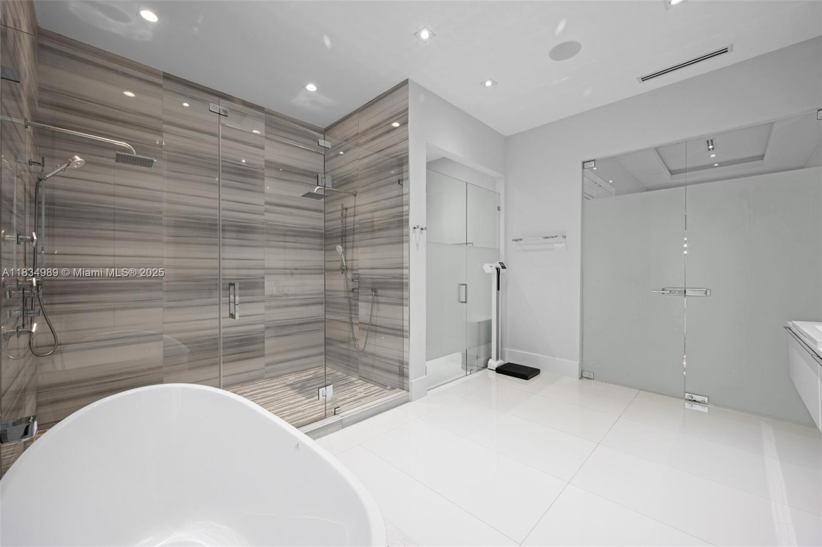 11350 Northwest 8th Street Plantation, FL 33325 - Photo 26 of 68 a bathroom with a sink and shower