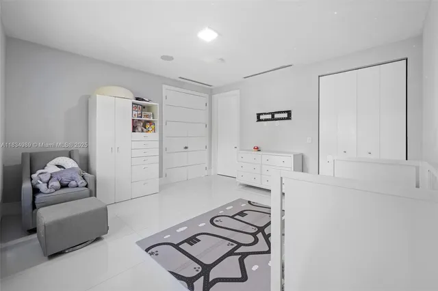 a view of walk in closet with clothes