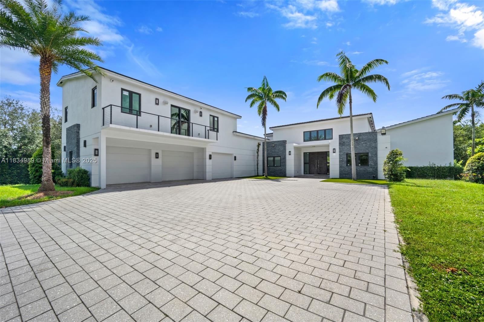 11350 Northwest 8th Street Plantation, FL 33325 - Photo 3 of 68 a front view of house with yard and green space