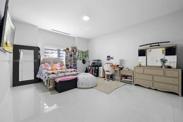 a utility room with cabinets washer and dryer