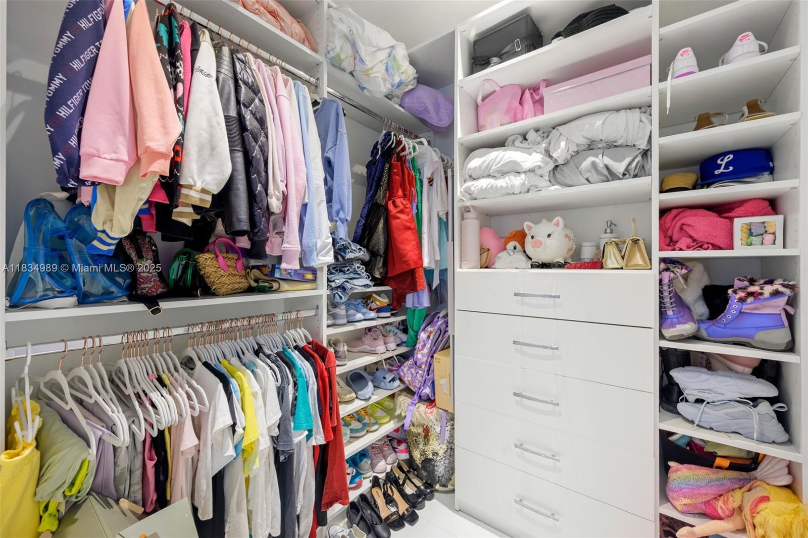 11350 Northwest 8th Street Plantation, FL 33325 - Photo 35 of 68 a view of walk in closet with clothes and shoes