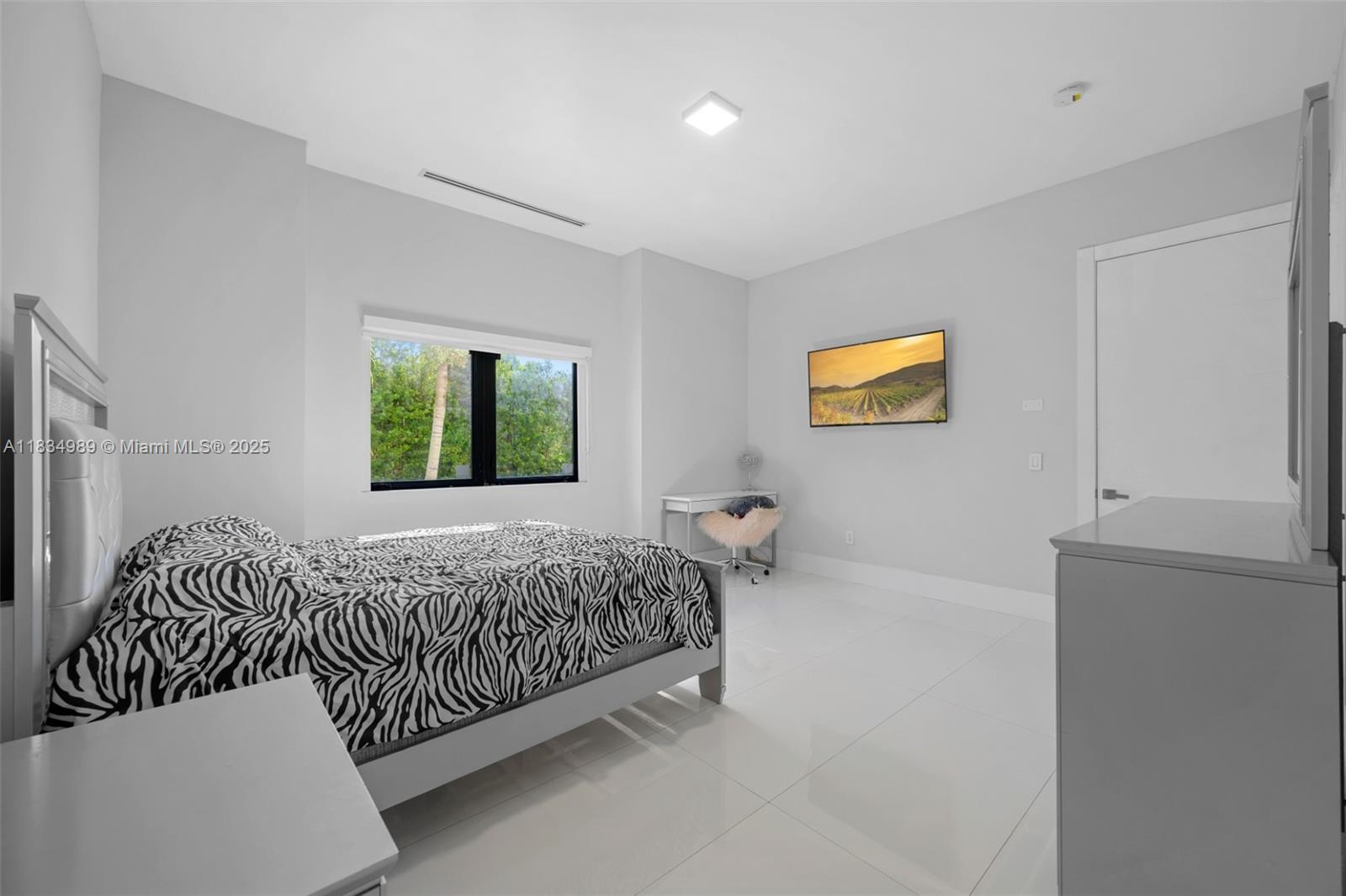 11350 Northwest 8th Street Plantation, FL 33325 - Photo 38 of 68 a bedroom with a bed and a window