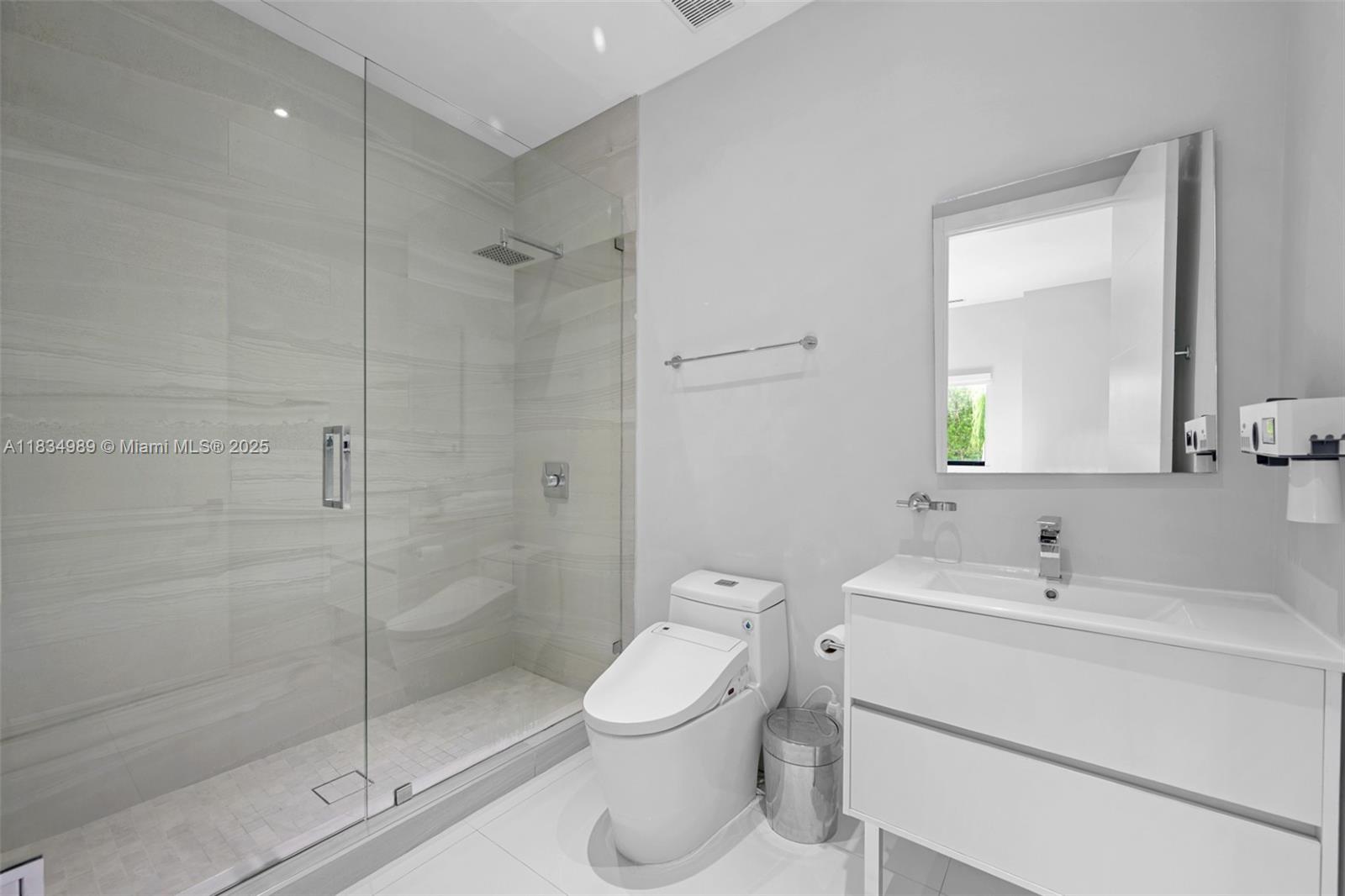 11350 Northwest 8th Street Plantation, FL 33325 - Photo 40 of 68 a bathroom with a toilet sink vanity and shower