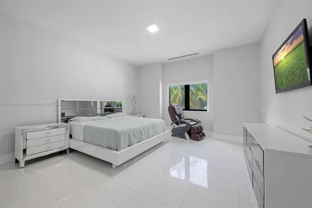 a kitchen with kitchen island granite countertop a sink dining table and chairs