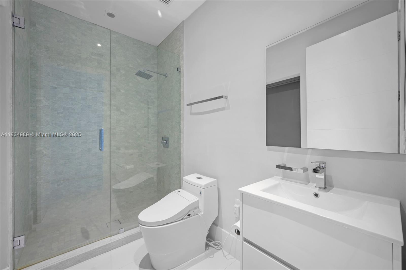 11350 Northwest 8th Street Plantation, FL 33325 - Photo 43 of 68 a bathroom with a toilet sink shower and mirror