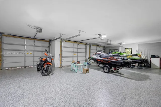 an aerial view of a house with pool yard and outdoor seating